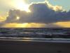 Lourivan de Araujo Souza: "Nascer do Sol do Sol entre as nuvens formando uma bela imagem, parece um dragão. Foto tirado na praia do Farol de Mostardas"