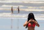 Com liberação do banho, veranistas aproveitam o mar de Tramandaí Lauro Alves/