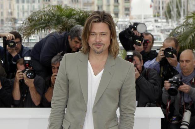 Em Cannes, Brad Pitt desmente boatos sobre data de casamento com Angelina Jolie Lionel Cironneau/AP
