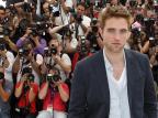 Robert Pattinson chega a Cannes na pele de um menino dourado e perigoso AFP PHOTO / VALERY HACHE/AFP