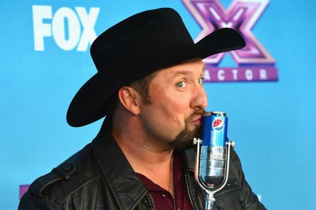 Cantor country Tate Stevens é o vencedor do reality musical 'The X Factor' Frazer Harrison/AFP
