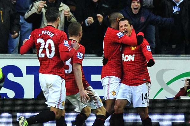Times de Manchester vencem na primeira rodada de 2013 PAUL ELLIS / AFP/