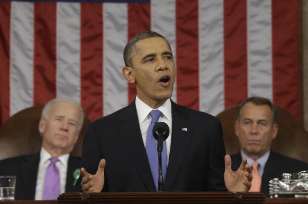 Obama pede impulso econômico, controle à venda de armas e reforma na lei de imigrações Charles Dharapak,Pool/AFP