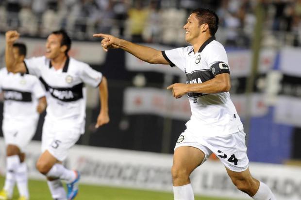 Tijuana vence Millonarios por 1 a 0 e Olimpia goleia Universidad de Chile Norberto Duarte/AFP