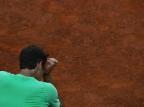 Federer está chorando? GABRIEL BOUYS/AFP Federer está chorando? GABRIEL BOUYS/AFP