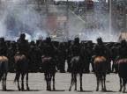 Manifestantes e polícia entram em novo confronto após o início de Brasil e México no Castelão Ernesto Carriço, Estadão Conteúdo/